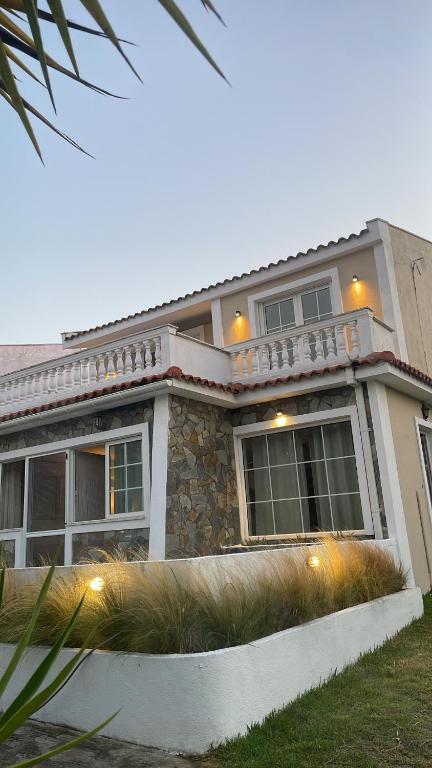 a large house with lights in front of it at Sakuras House in Pesádha