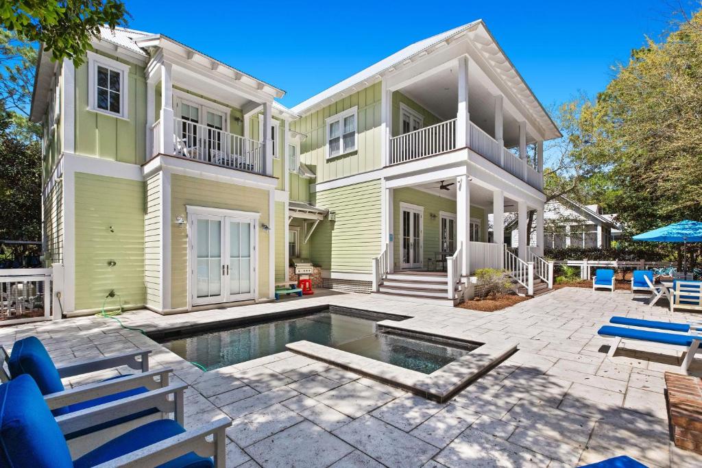 a house with a swimming pool in front of it at WaterColor Escape in Santa Rosa Beach