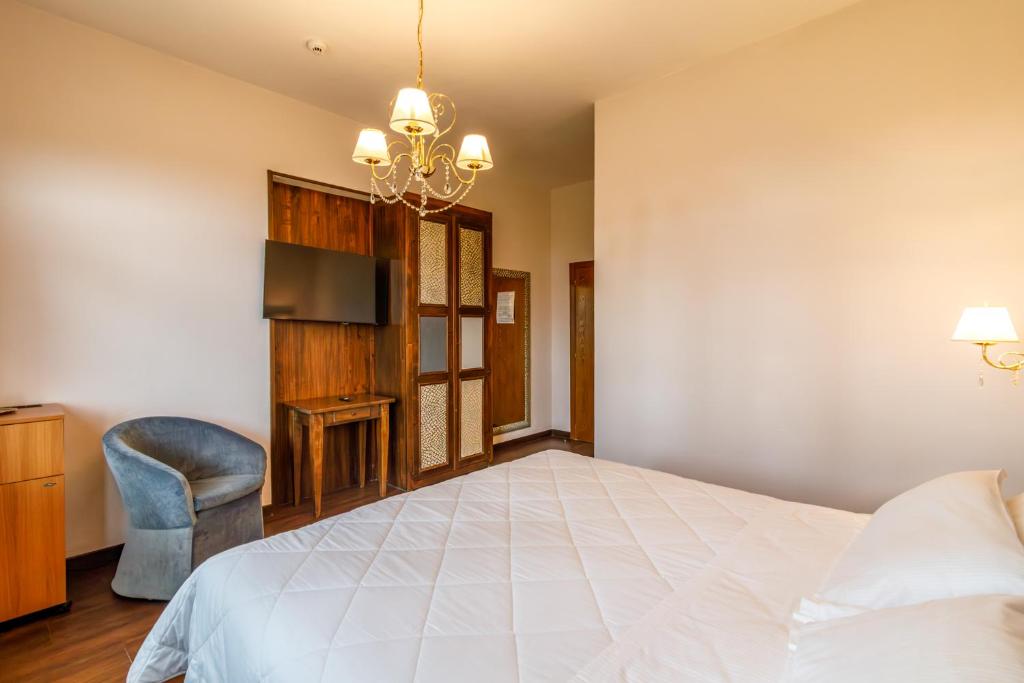 Postel nebo postele na pokoji v ubytování Villa Lecchi Hotel Wellness
