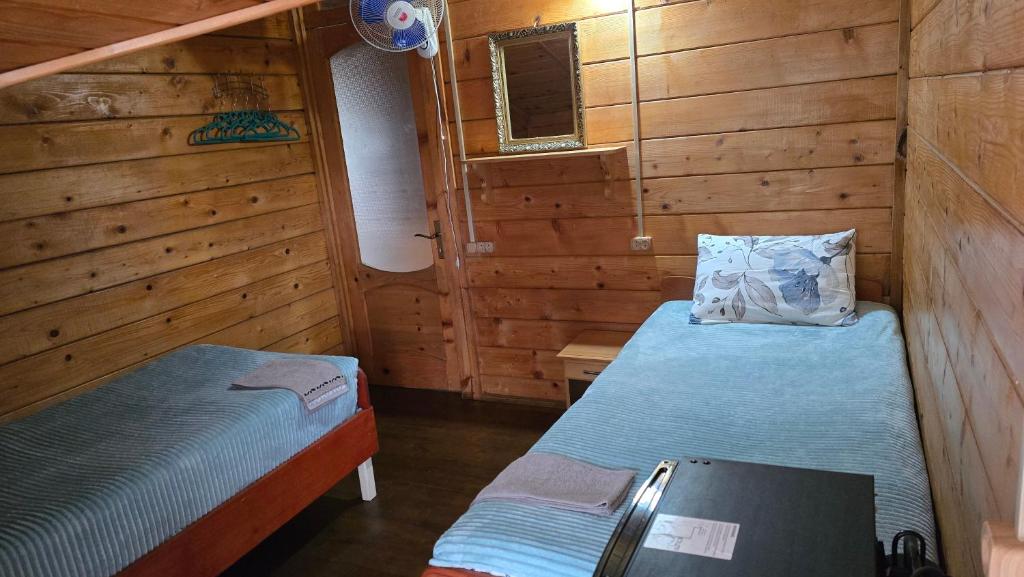 Postel nebo postele na pokoji v ubytování Olga's Home