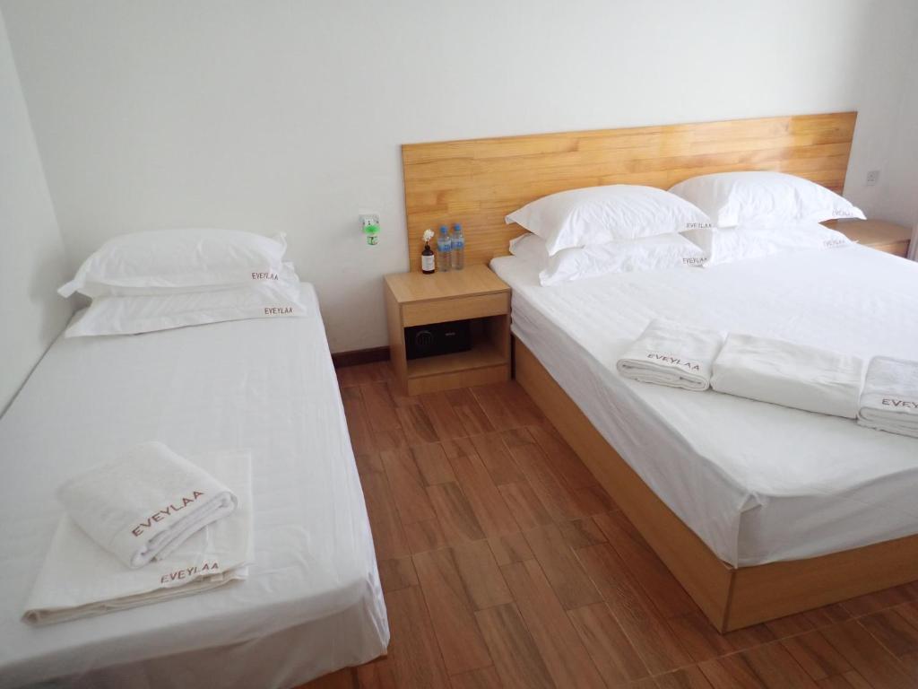 Postel nebo postele na pokoji v ubytování Eveylaa Guesthouse
