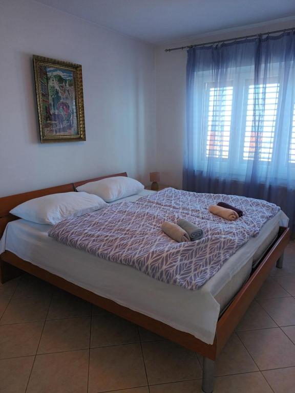 Posteľ alebo postele v izbe v ubytovaní Vuke Apartments