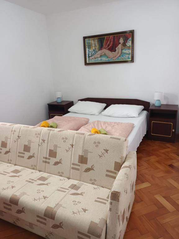 Posteľ alebo postele v izbe v ubytovaní Vuke Apartments