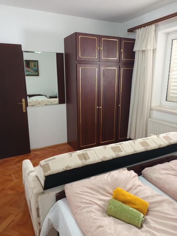 Posteľ alebo postele v izbe v ubytovaní Vuke Apartments
