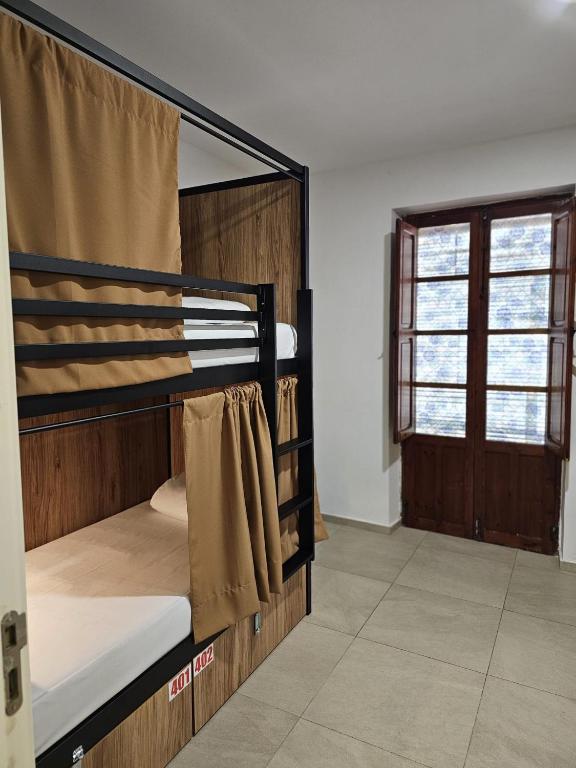 A bed or beds in a room at Hostel Welcome Benidorm