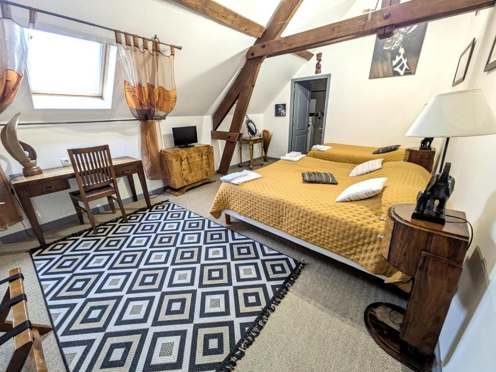 Postel nebo postele na pokoji v ubytování Chateau de Quesmy