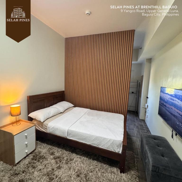 Postel nebo postele na pokoji v ubytování Selah Pines at Brenthill Baguio