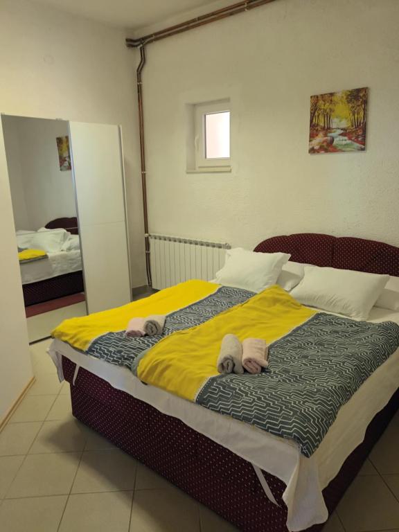 Posteľ alebo postele v izbe v ubytovaní Vuke Apartments