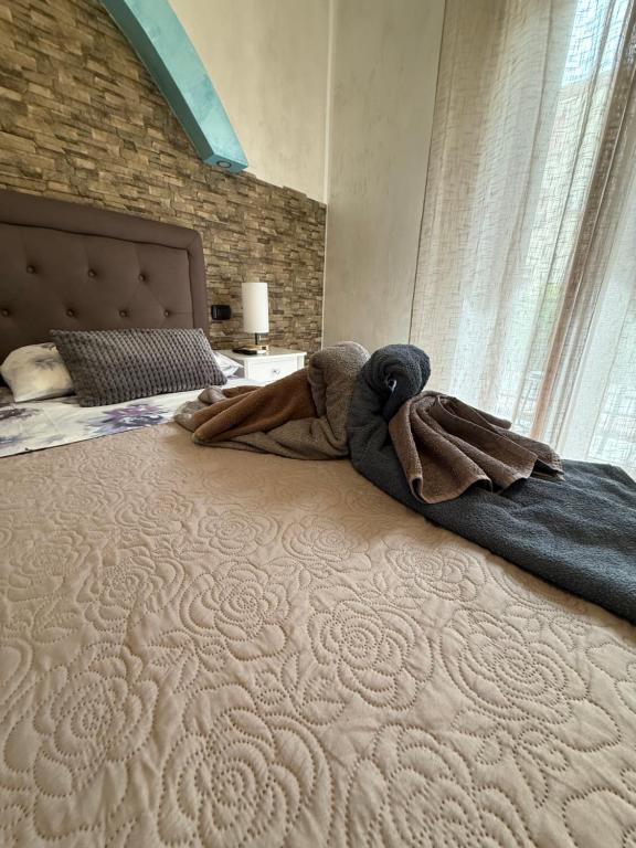 Postel nebo postele na pokoji v ubytování Acqua Azzurra