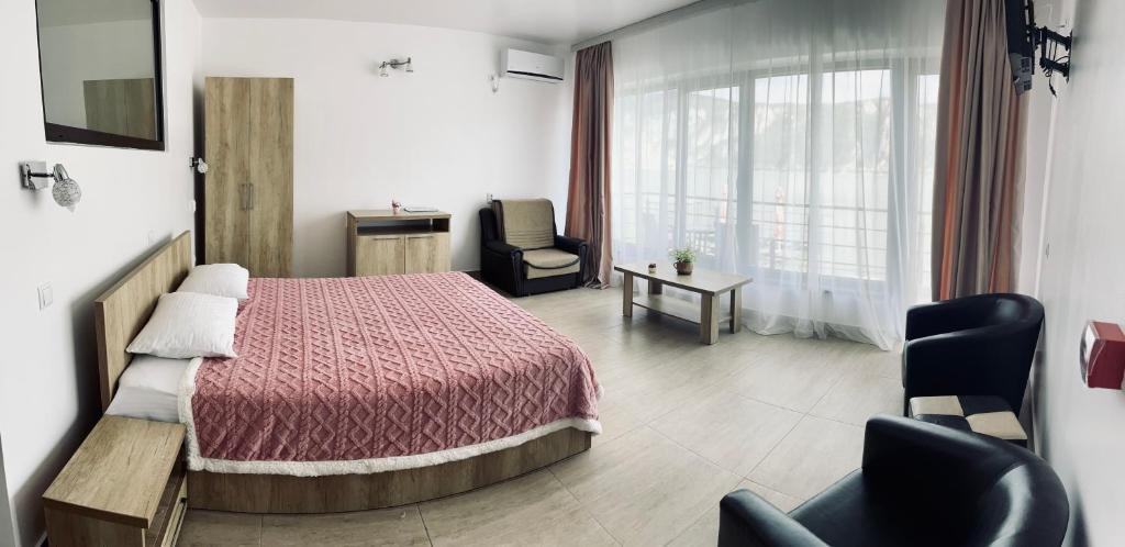 Postel nebo postele na pokoji v ubytování MELBA 3 flori cazanele Dunarii