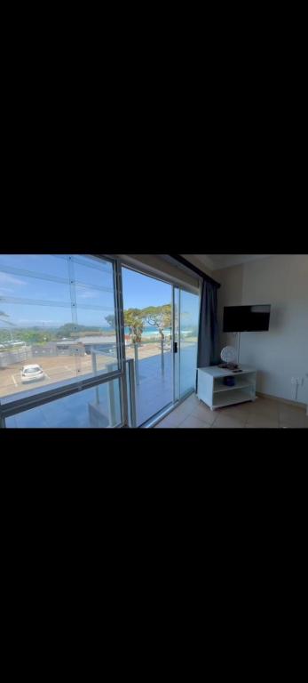 a view of a room with a view of the ocean at SANTANA 107 Margate in Margate