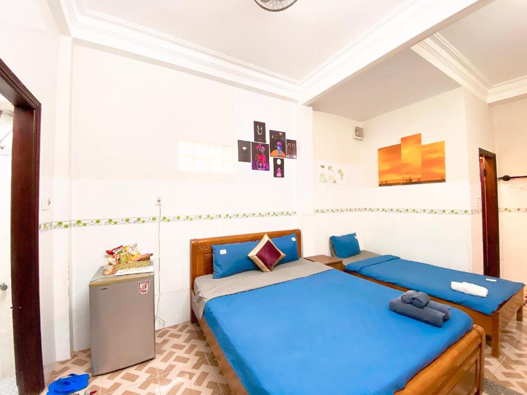 Postel nebo postele na pokoji v ubytování DK House Homestay