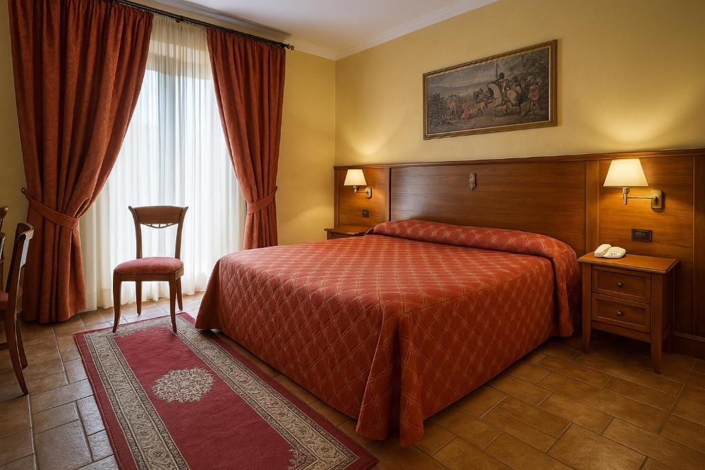 Postel nebo postele na pokoji v ubytování Grand Hotel Vigna Nocelli