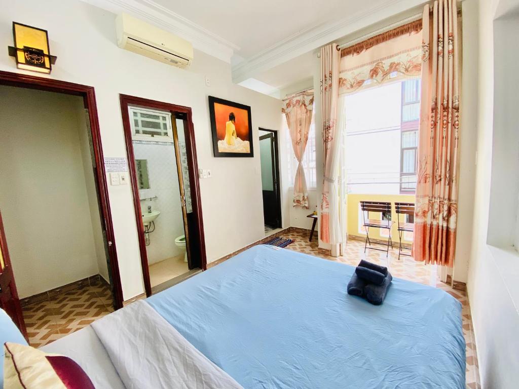 Postel nebo postele na pokoji v ubytování DK House Homestay