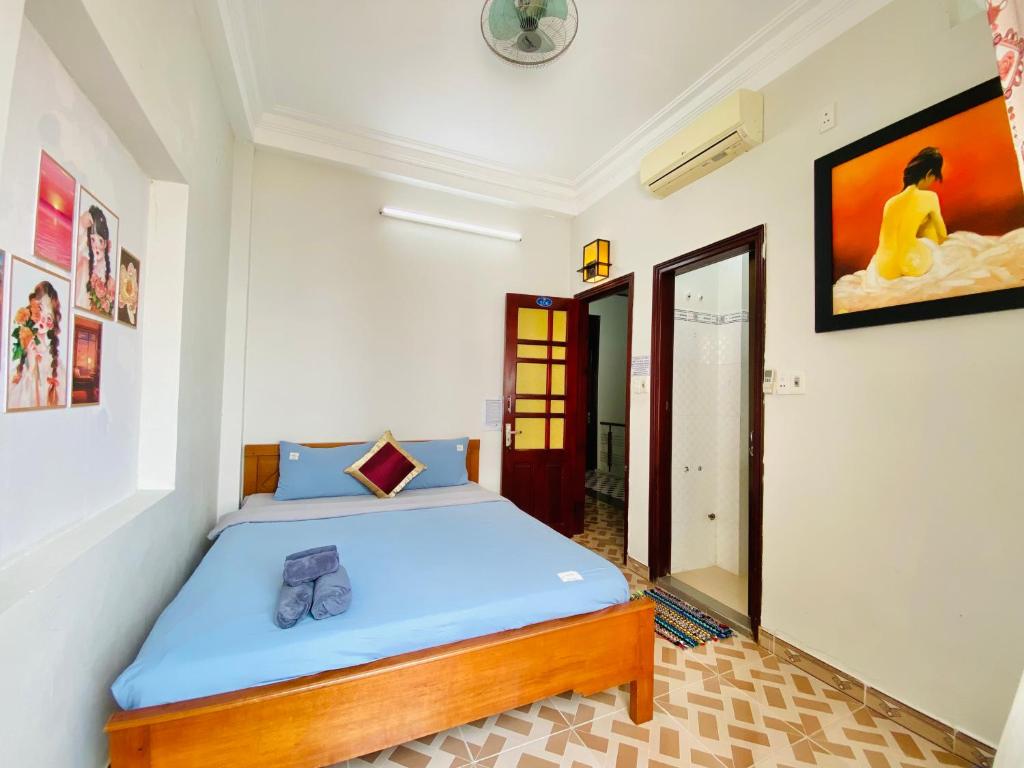 Postel nebo postele na pokoji v ubytování DK House Homestay