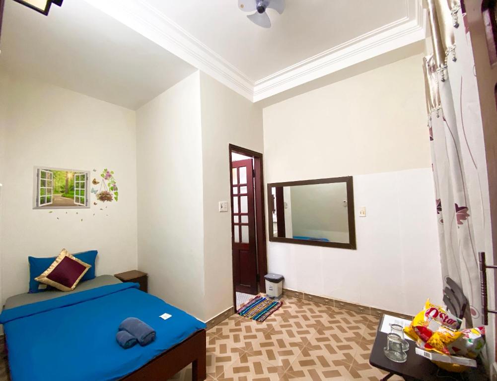 Postel nebo postele na pokoji v ubytování DK House Homestay