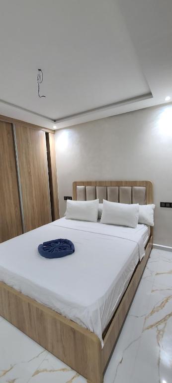 Postel nebo postele na pokoji v ubytování appartment igar azougagh elhoceima