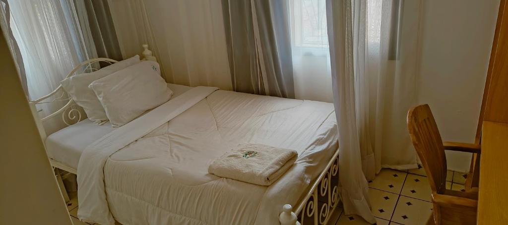 Postel nebo postele na pokoji v ubytování MELVIC INN