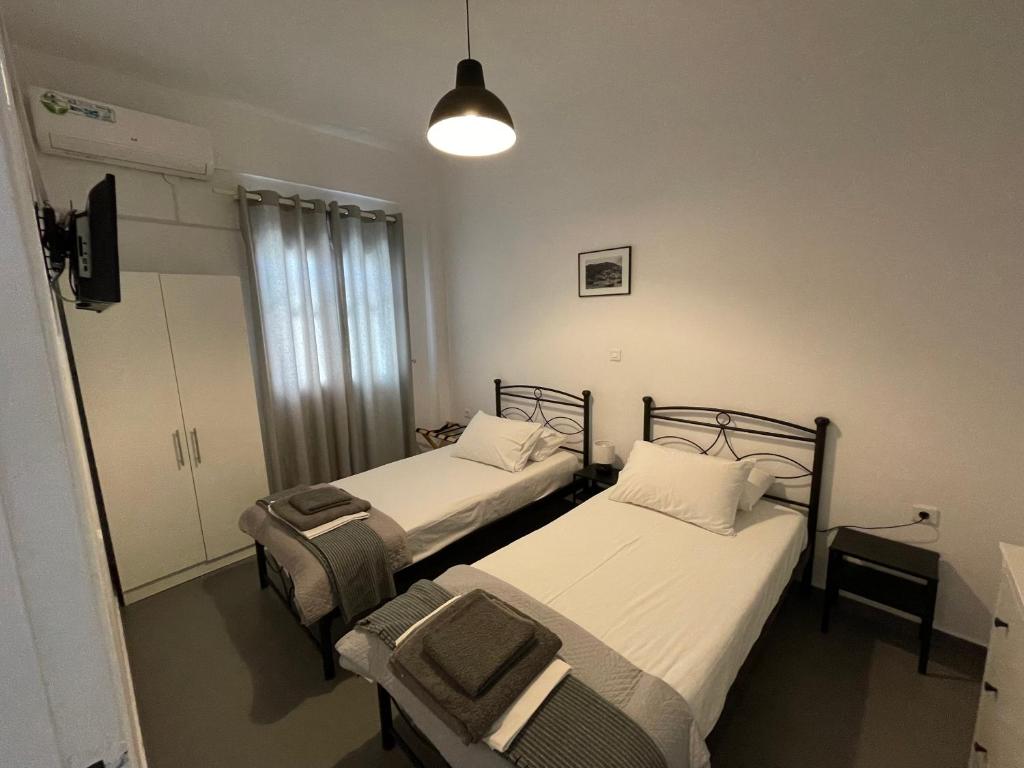 Postel nebo postele na pokoji v ubytování Spanos Studios - Panteli