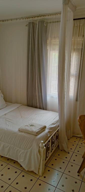 Postel nebo postele na pokoji v ubytování MELVIC INN