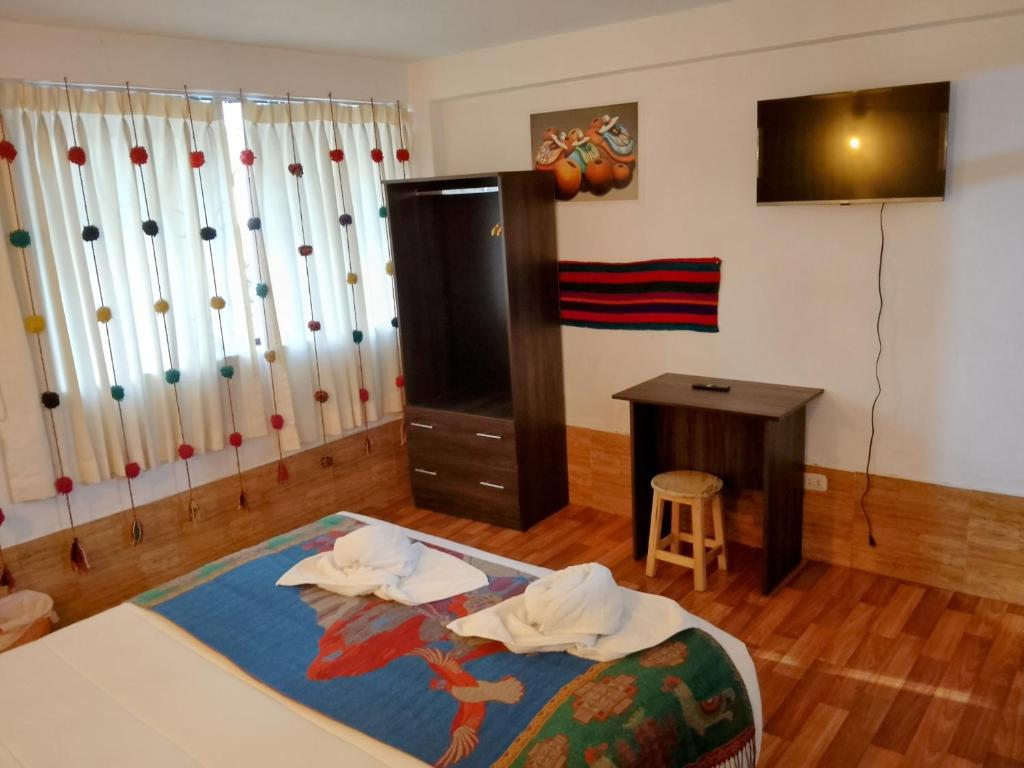 Postel nebo postele na pokoji v ubytování Inca Town In
