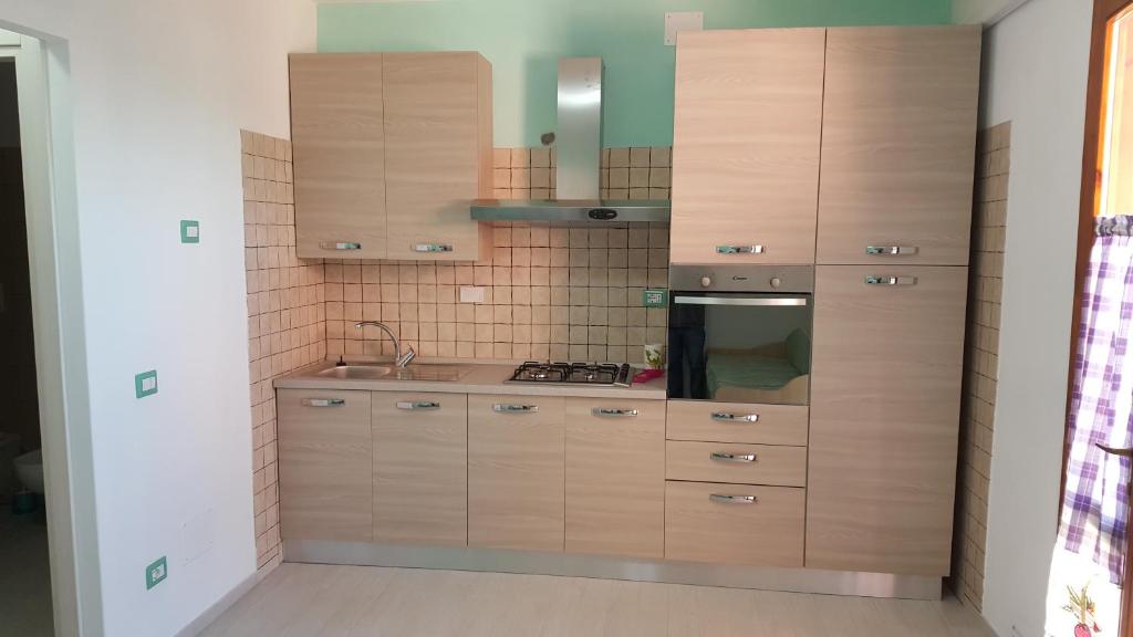 Kuchyň nebo kuchyňský kout v ubytování Appartamenti Lucry