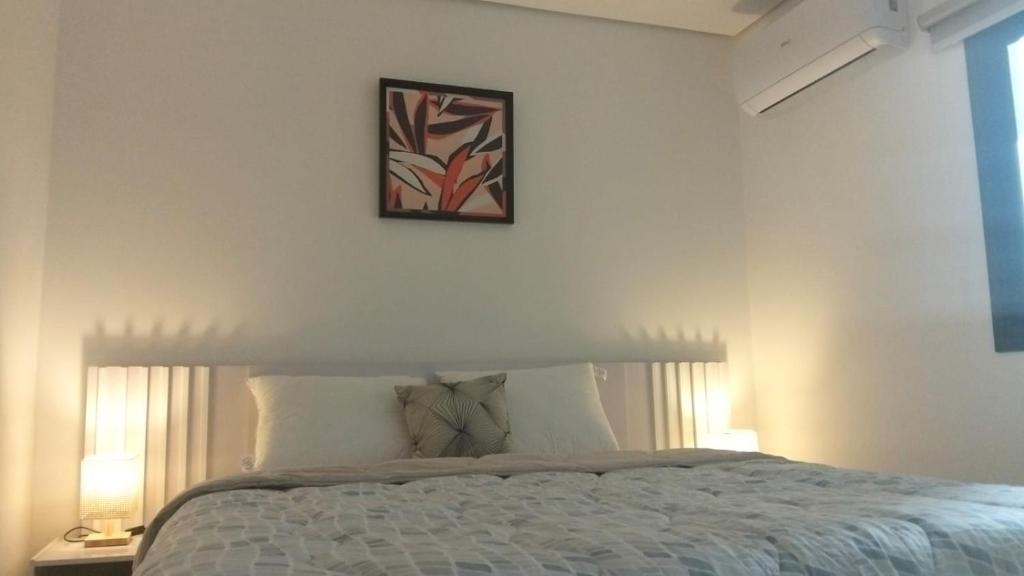 Postel nebo postele na pokoji v ubytování Edificio Emperador