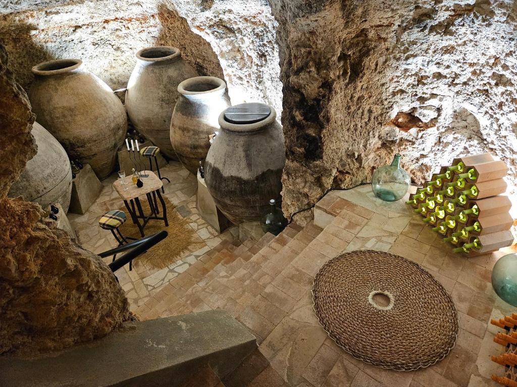 a group of vases lined up in a room at Casa de la Plata in Colmenar de Oreja