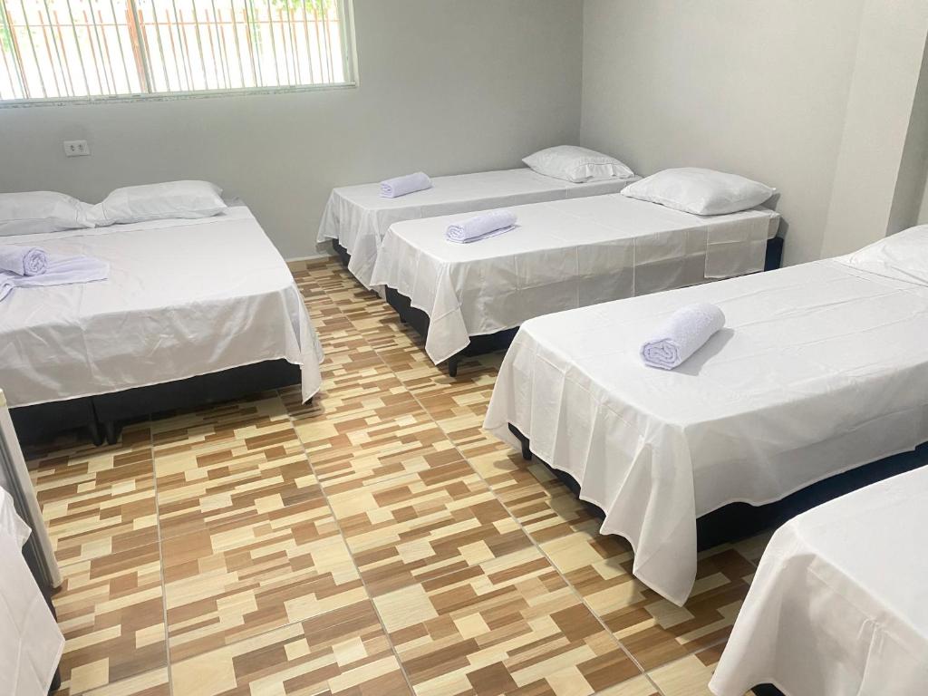Postel nebo postele na pokoji v ubytování Pousada Sagrada Devoção