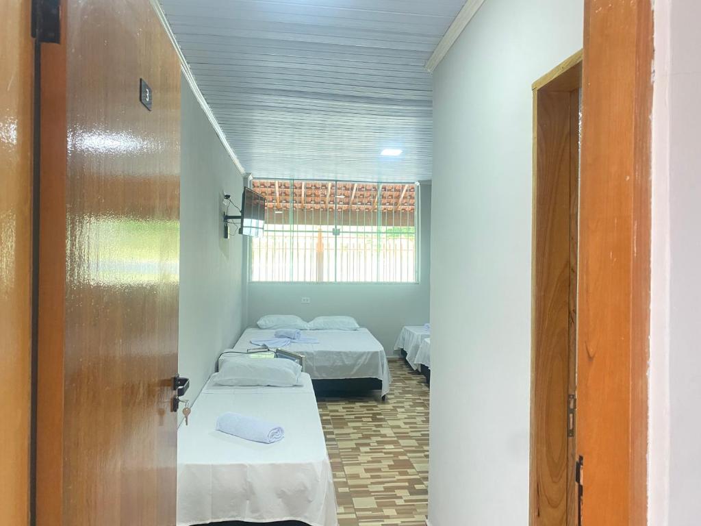 Postel nebo postele na pokoji v ubytování Pousada Sagrada Devoção