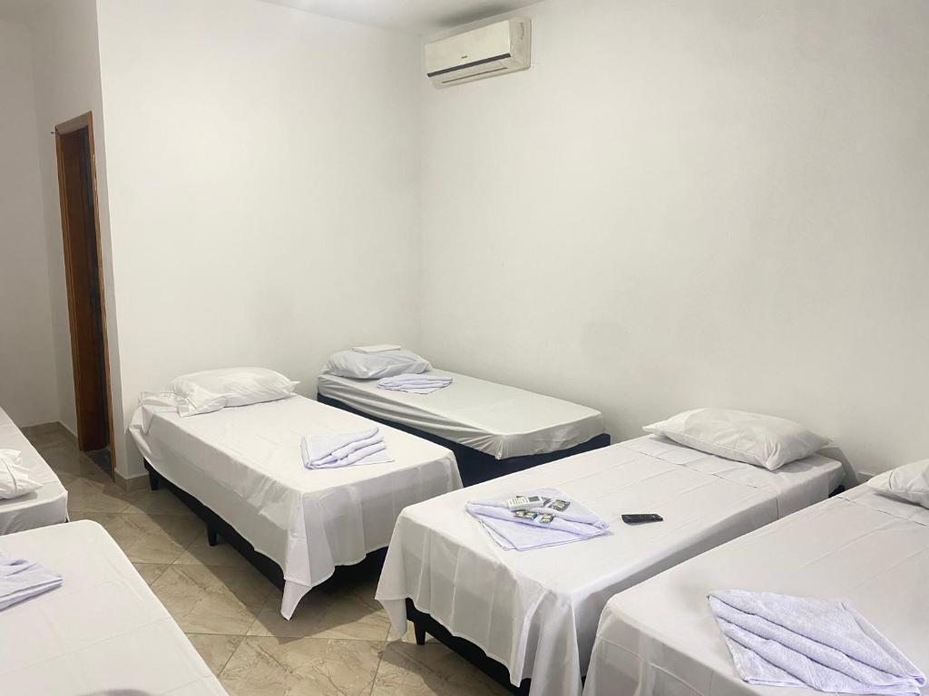 Postel nebo postele na pokoji v ubytování Pousada Sagrada Devoção
