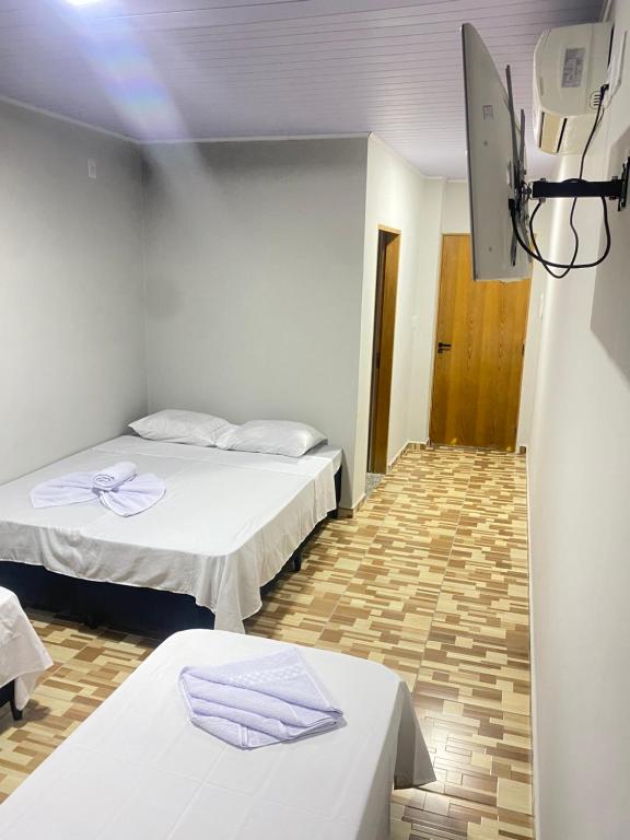 Postel nebo postele na pokoji v ubytování Pousada Sagrada Devoção