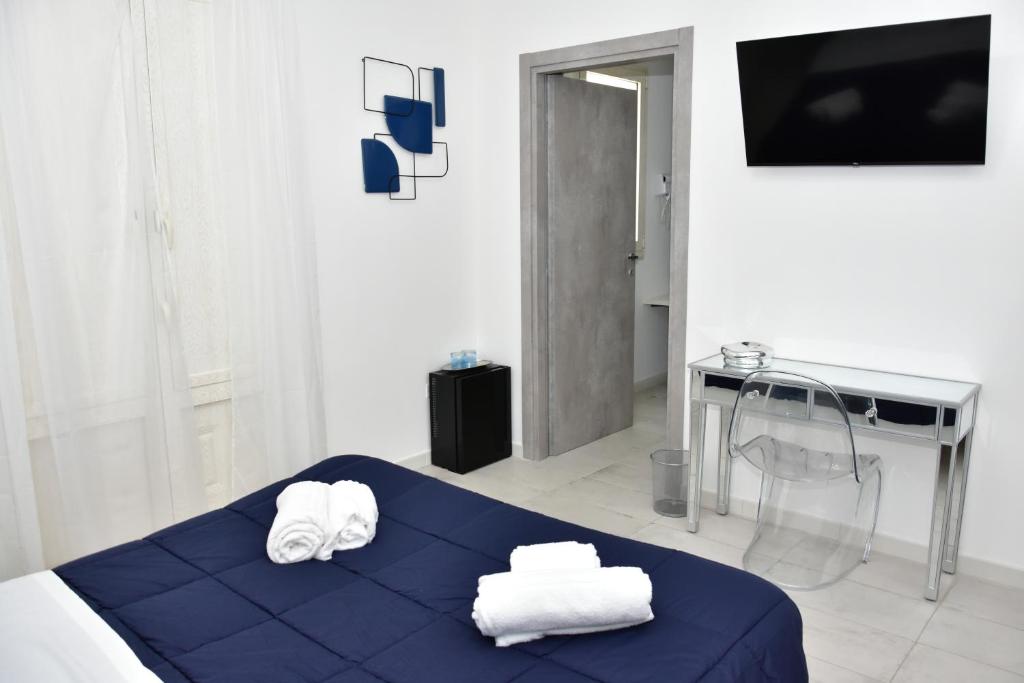Postel nebo postele na pokoji v ubytování Yllen Rooms