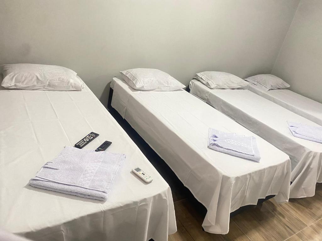 Postel nebo postele na pokoji v ubytování Pousada Sagrada Devoção
