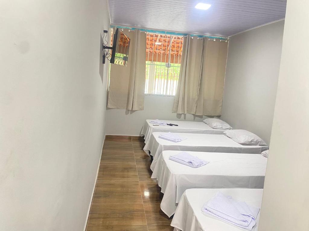 Postel nebo postele na pokoji v ubytování Pousada Sagrada Devoção