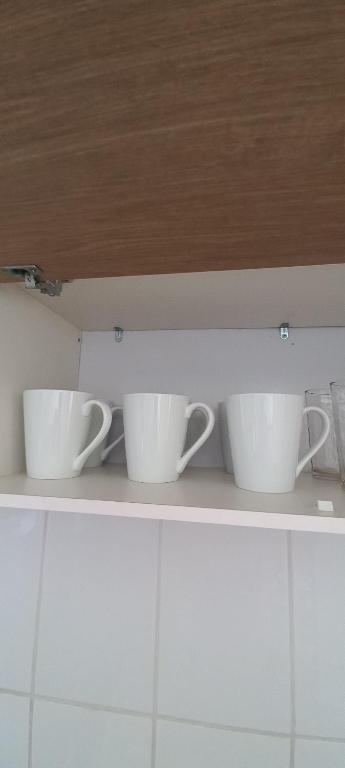 Příslušenství pro přípravu čaje a kávy v ubytování Cómodo y acogedor departamento 2D1B