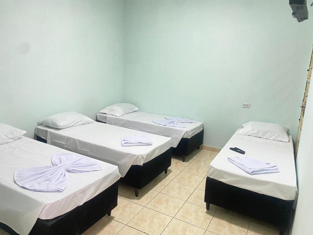 Postel nebo postele na pokoji v ubytování Pousada Sagrada Devoção