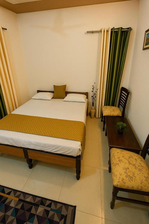 Postel nebo postele na pokoji v ubytování Anandmay Homestay