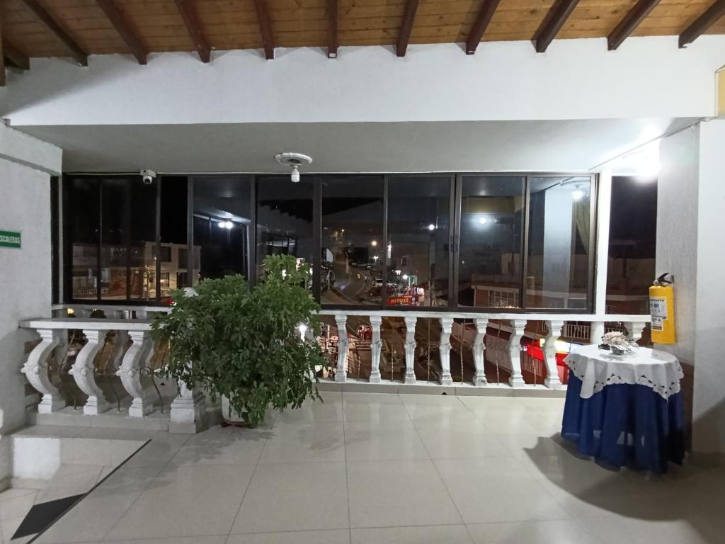 a store with a table in a room with windows at Hotel Villa Sol in Oiba