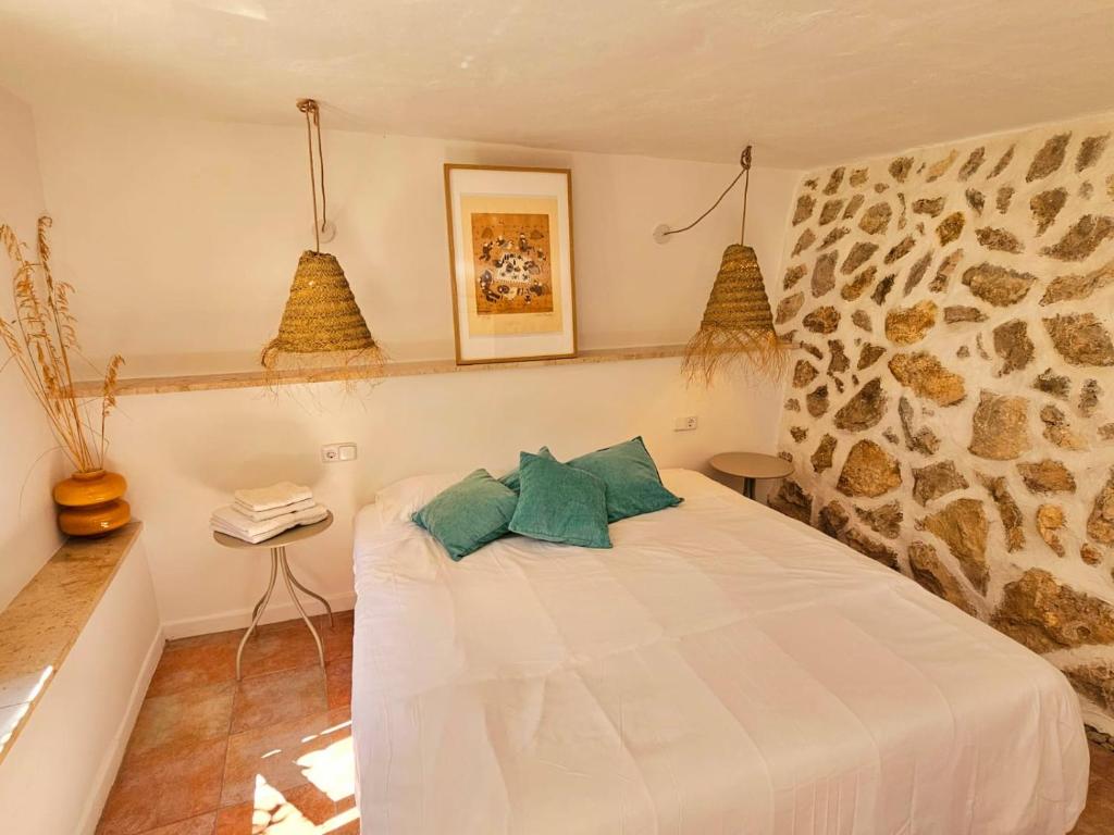 Postel nebo postele na pokoji v ubytování Agroturismo Finca Can Sec