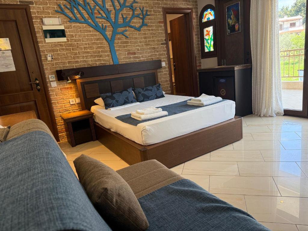 Postel nebo postele na pokoji v ubytování Kappa Rooms Boutique Hotel