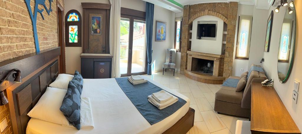 Postel nebo postele na pokoji v ubytování Kappa Rooms Boutique Hotel
