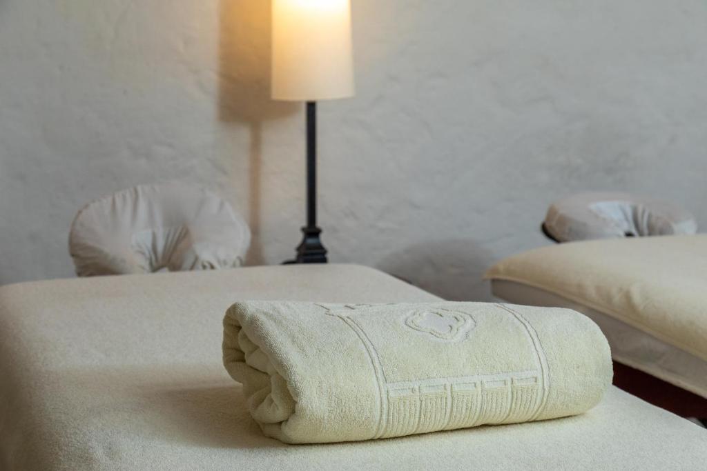Postel nebo postele na pokoji v ubytování Hotel Boutique Casa del Coliseo