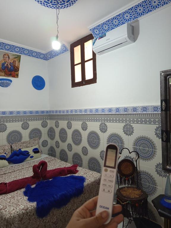 Postel nebo postele na pokoji v ubytování Riad Derb El Aarsa