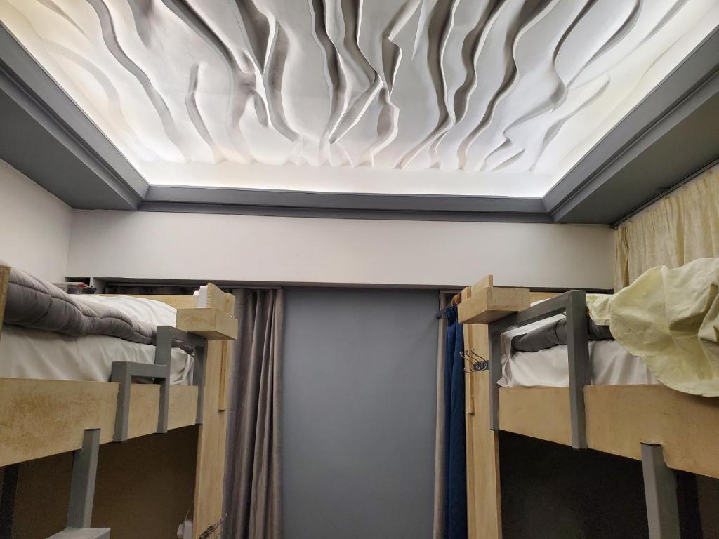 Letto o letti in una camera di Wander Luxe