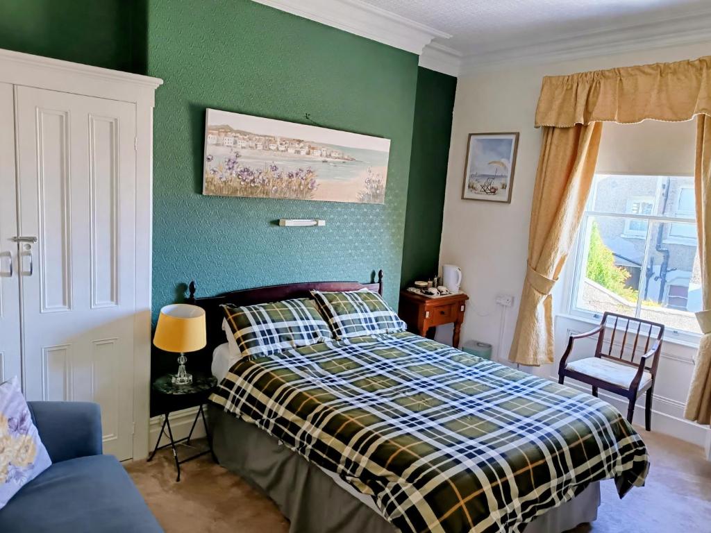 Postel nebo postele na pokoji v ubytování Bron Orme Private Hotel