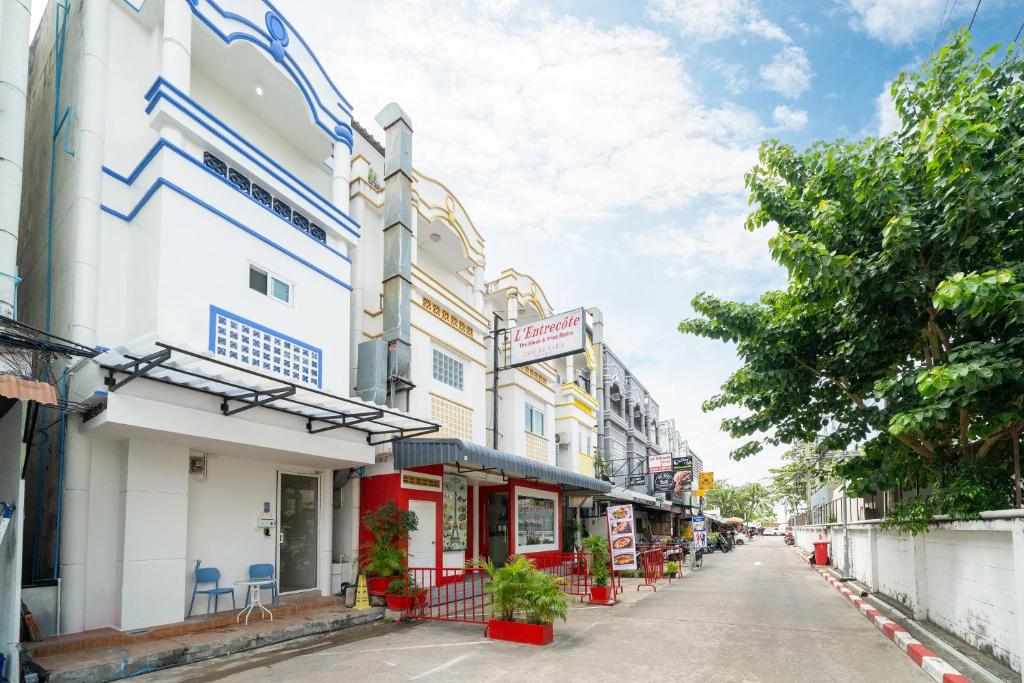 a street in a city with buildings at Winks Beach Patong Phuket in Patong Beach