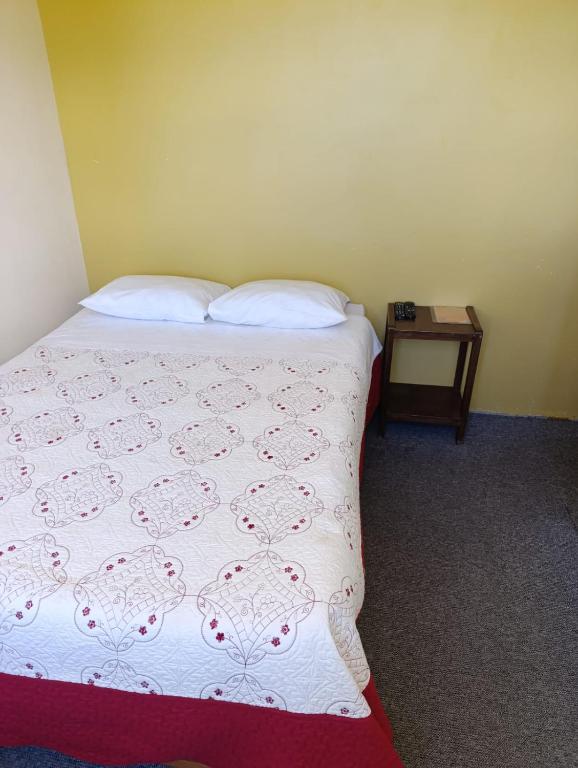 Postel nebo postele na pokoji v ubytování Hotel Summita