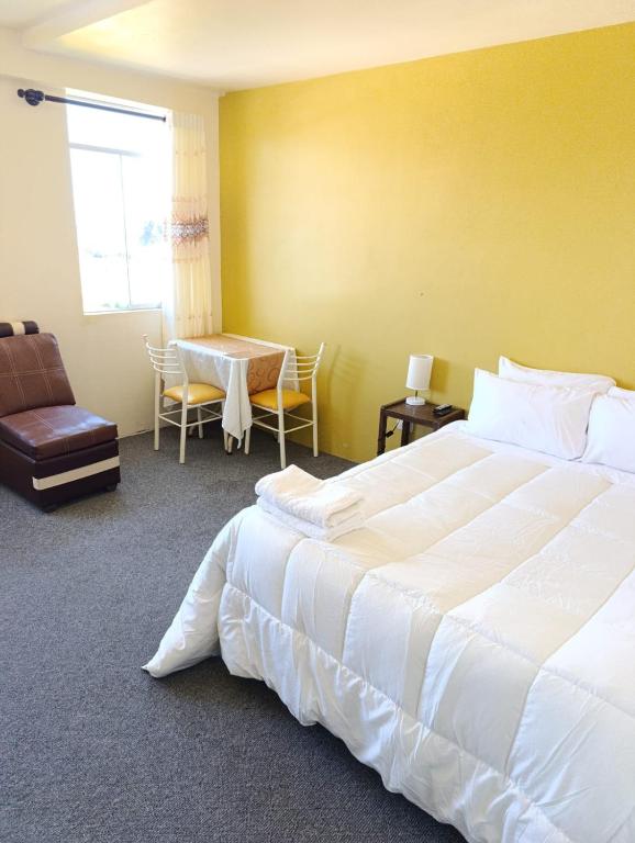 Postel nebo postele na pokoji v ubytování Hotel Summita