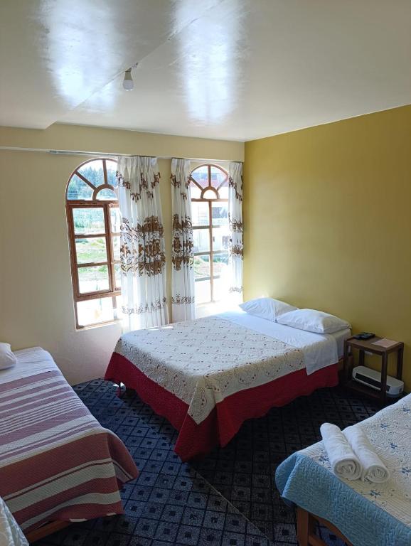 Postel nebo postele na pokoji v ubytování Hotel Summita
